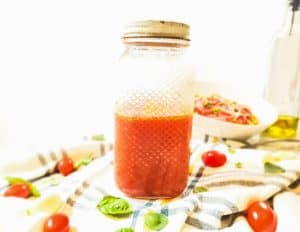 Marinara sauce in a glass mason jar. 