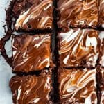 Overhead shot of brownies on parchment paper.