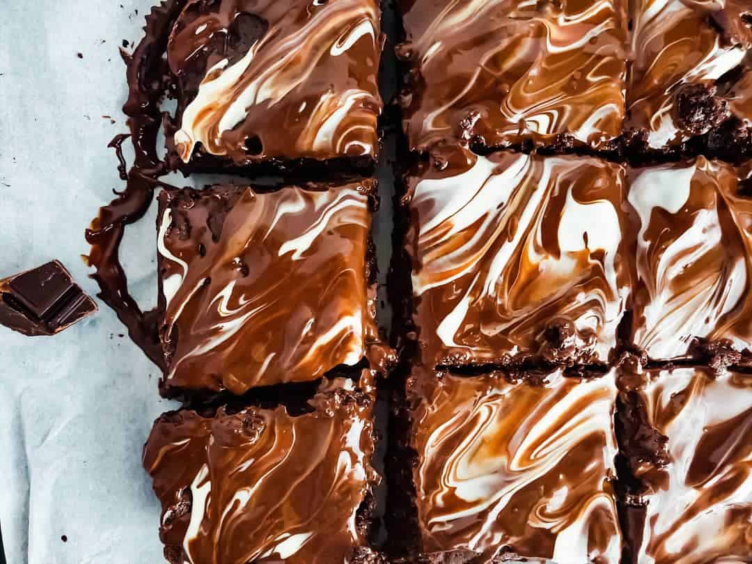 Overhead shot of brownies on parchment paper.