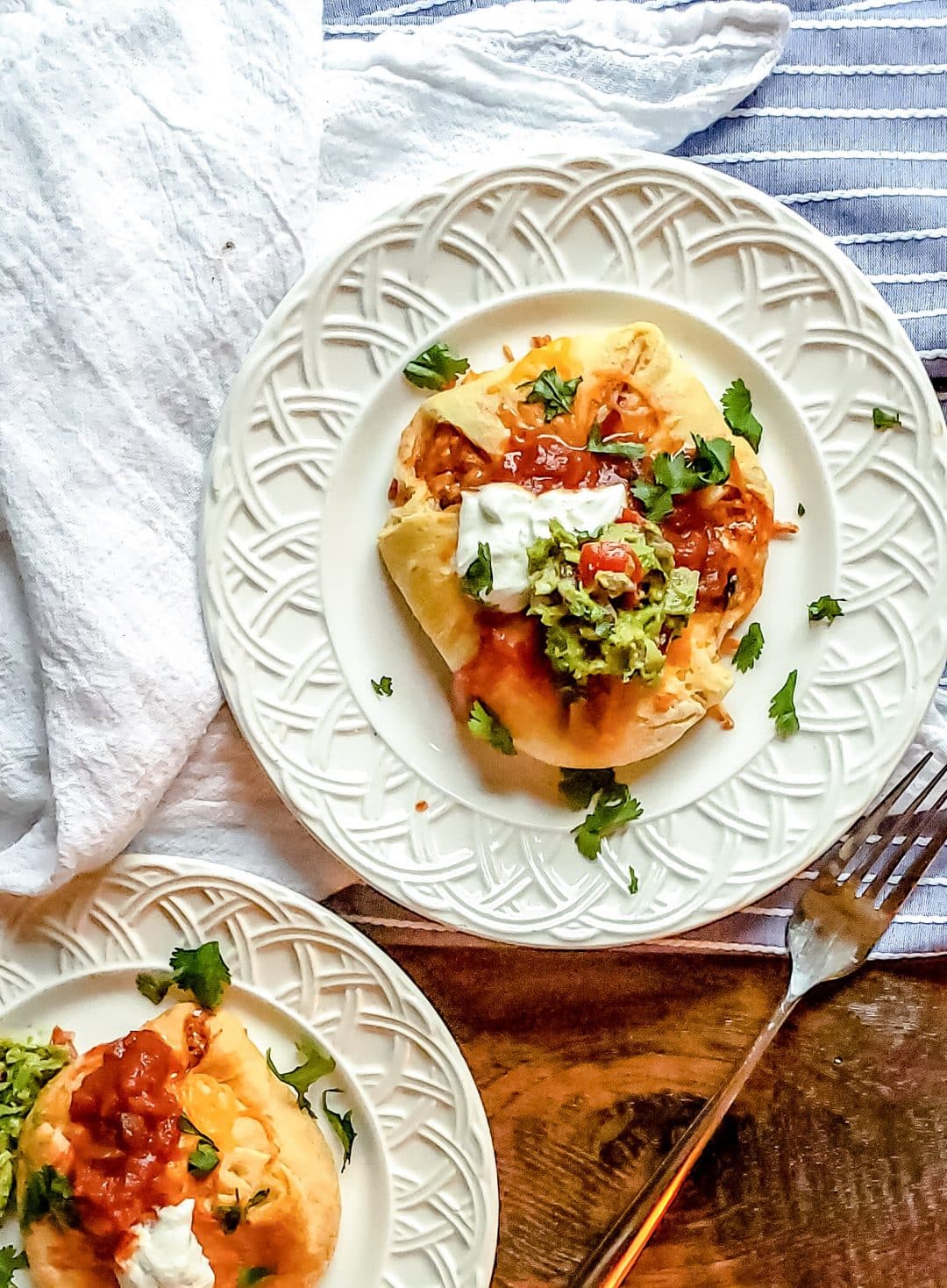 This Chicken Puffs Recipe: Enchilada Style is the best Mexican and American food fusion dinner recipe! Mexican flavors all wrapped in Pillsbury crescent rolls and topped with cheese! Top with your favorite salsa, guacamole or sour cream to finish it off! The perfect combo for an amazing easy family meal! #MexicanFood #crescentrolls #dinnerideas #dinenrrecipes #easymealideas