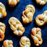 This Homemade Soft Pretzels recipe combines amazing flavors, super easy, and goes perfect with cheese dip and cheese sauce! These pretzels are the best appetizer for game days, holidays, and parties! The pretzels go perfectly with beer cheese, chipotle queso, and classic american cheese sauce! #softpretzels #homemade #appetizer #pretzelswithcheese #pretzelrecipe