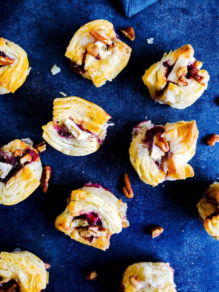 These Blackberry Brie Bites with Pecan Sage topping are the best simple, fast holiday appetizer recipe. Ready in 20 minutes and easy to hold size makes this Thanksgiving and Christmas recipe the best. #appetizer #recipe #holidays #Thanksgiving #Christmas