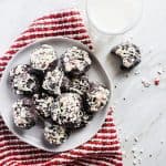 These Chocolate Cake Cookies with White Chocolate Peppermint Sprinkle is the perfect Christmas cookie recipe. These cookies use a boxed cake mix, cream cheese, butter and of course dark chocolate chips for the best flavor combination. You will love this easy baking recipe for the holiday season! #holidays #Christmas #Cookies #recipe #baking