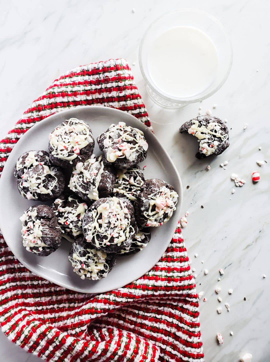 These Chocolate Cake Cookies with White Chocolate Peppermint Sprinkle is the perfect Christmas cookie recipe. These cookies use a boxed cake mix, cream cheese, butter and of course dark chocolate chips for the best flavor combination. You will love this easy baking recipe for the holiday season! #holidays #Christmas #Cookies #recipe #baking