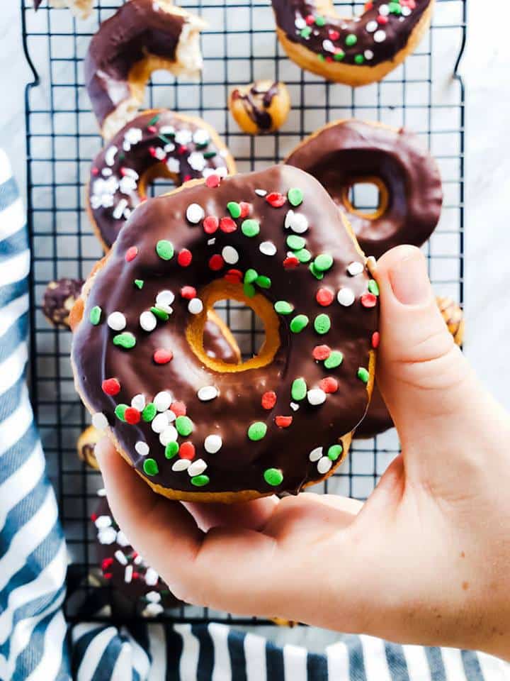 Hand holding donut.