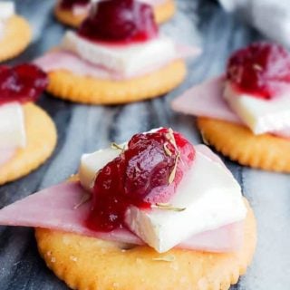 These Ritz Bites with Ham, Brie and Cranberries are the best bite-size appetizer recipe for the holiday season! Easy and ready in about 10 minutes these require no baking and are perfect for both kids and adults. Make you Thanksgiving, Christmas or New Years Eve perfect with these goodies! #appetizer #Christmas #Holidays