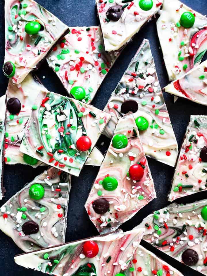 Overhead shot of chocolate bark broken on blue counter.