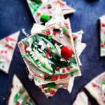 This Christmas Chocolate Bark recipe is perfect for the holiday season! It combines two layers of semi sweet and white chocolate and is topped with peppermint, M&m's and candy. This recipe is easy and makes the best gift for friends, family or to keep for yourself. #Christmas #Homemade #Gift #Chocolate #Recipe