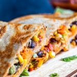 These Vegetarian Quesadillas are the perfect quick 30 minute, one pan dinner or lunch recipe. Filled with sweet potato, black beans, avocado, corn, peppers and cheese these are super tasty and healthy. Perfect for both kids and adults! #erhardtseat #Vegetarian #30minutemeal #onepan #Mexican #Quesadillas