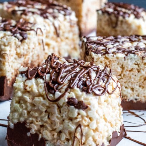 These Nutella Rice Krispie Treats are the perfect classic snack with a fun twist for both kids and adults. This easy no-bake dessert will satisfy any sweet tooth and perfect for families and for kids to help. #desserts #Nutella #Easy #recipe #kidsfood