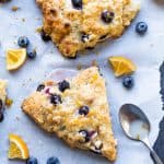 These Blueberry White Chocolate Scones with Lemon Glaze are the perfect sweet breakfast or afternoon tea treat! This easy dessert recipe will be your new family favorite! #scones #breakfast #dessert #blueberry #recipe