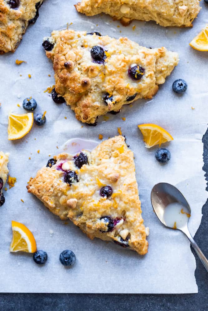 These Blueberry White Chocolate Scones with Lemon Glaze are the perfect sweet breakfast or afternoon tea treat! This easy dessert recipe will be your new family favorite! #scones #breakfast #dessert #blueberry #recipe