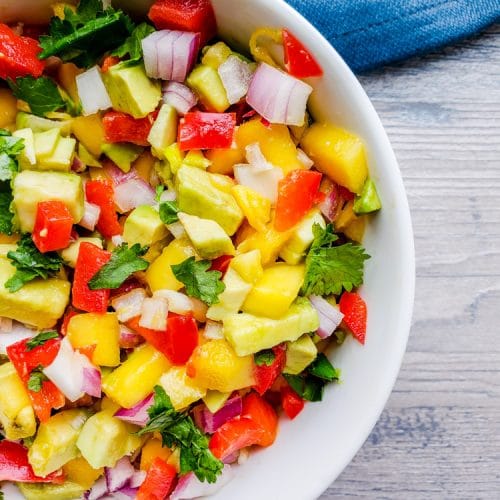 This Easy Mango Avocado Salsa is the BEST fresh summer salsa made with mango, avocado, cilantro, red onion and red pepper. Perfect on its own with chips or paired with your favorite Mexican food like tacos! #salsa #healthy #vegan #vegetarian