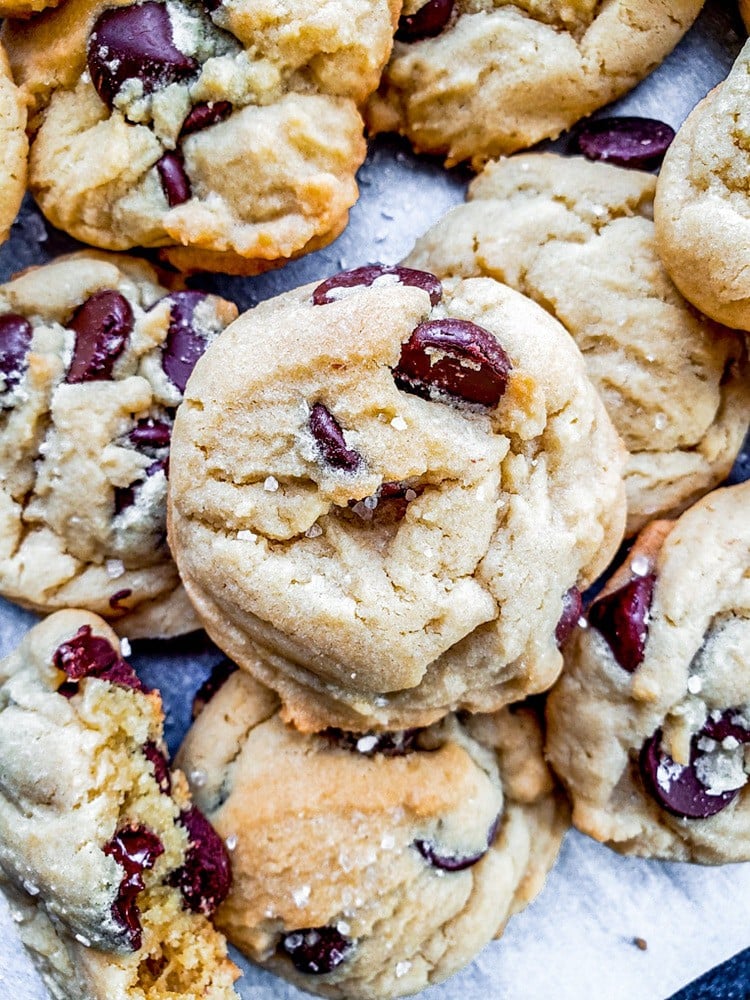 This Salted Chocolate Chip Cookie recipe is the best treat for any occasion including holidays, birthdays, or for a school treat. Packed with dark chocolate chips and topped with a hint of sea salt these cookies are easy and require no chilling. #baking #desserts #cookies