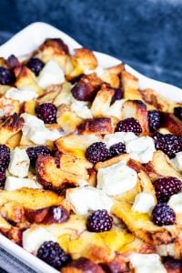 This Overnight Baked Cinnamon French Toast Casserole with blackberries and cream cheese is the best easy recipe for brunch or breakfast for a crowd! Perfect for holidays, parties, Thanksgiving, Christmas, or a weekend treat for the family. Make ahead of time for simple prep freezer friendly! {VIDEO} #breakfast #FrenchToast #Blackberries #MakeAheadMeal