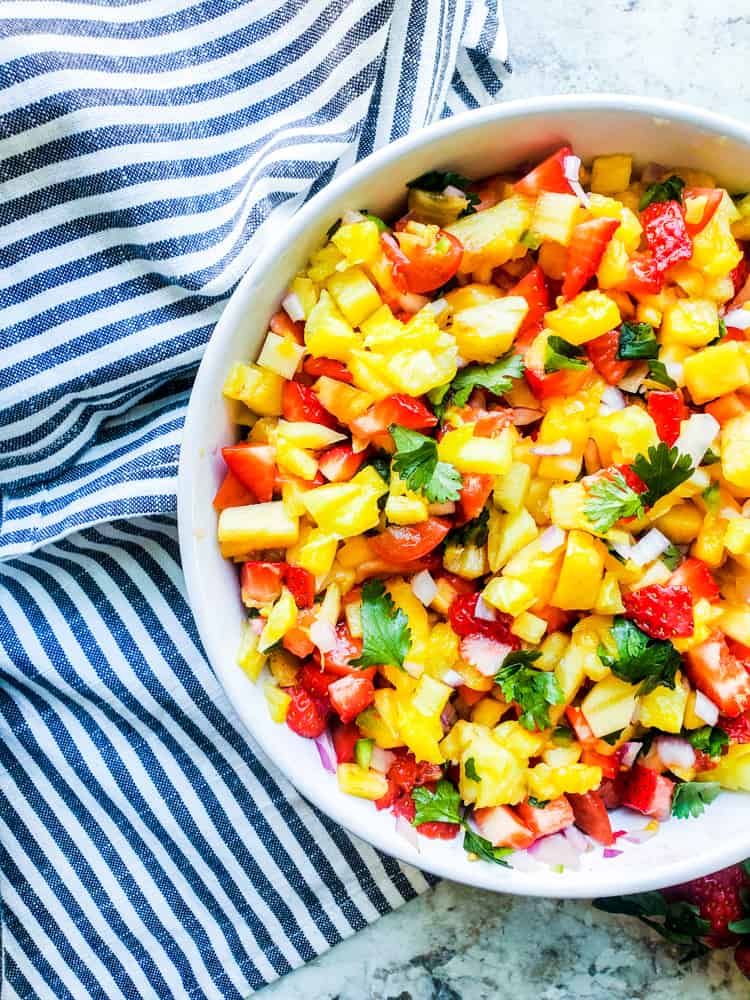 Overhead shot of salsa in a white bowl.