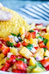 Close up shot of salsa in a white bowl.