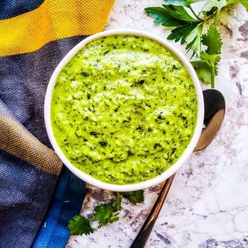 This Easy Chimichurri Sauce recipe is the best for grilled meats, veggies, as a marinade, or a dip! This traditional Mexican sauce is ready in only five minutes and made with cilantro, parsley, olive oil, spice, and garlic. Also this sauce is naturally healthy, vegan, gluten free, low-card, whole 30, keto, and paleo. #sauce #chimichurri #easyrecipe #vegan
