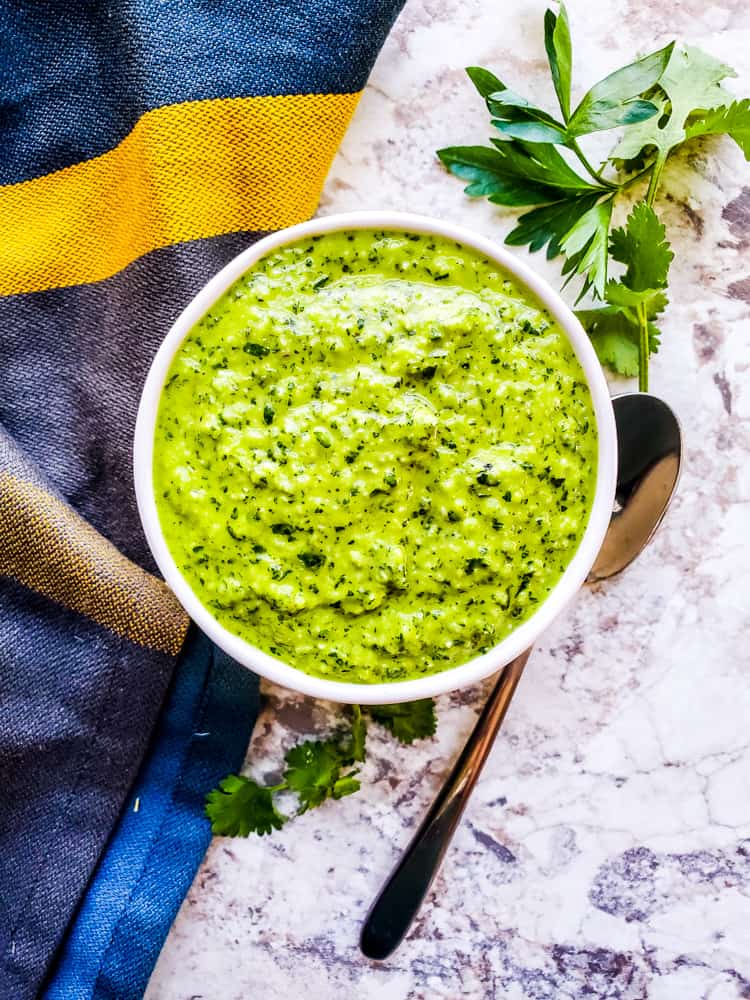 This Easy Chimichurri Sauce recipe is the best for grilled meats, veggies, as a marinade, or a dip! This traditional Mexican sauce is ready in only five minutes and made with cilantro, parsley, olive oil, spice, and garlic. Also this sauce is naturally healthy, vegan, gluten free, low-card, whole 30, keto, and paleo. #sauce #chimichurri #easyrecipe #vegan