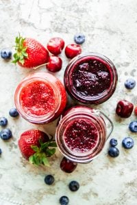 This Easy Jam Recipe is healthy, easy, made with only 3 ingredients (fruit, honey, and chia seeds), made without pectin and ready in only 10 minutes! The best spread for bagels, toast or any breakfast favorite. This recipe is also food sensitivity friendly and is gluten free, nut free, vegan, dairy free, paleo, vegetarian. Enjoy this no canning required blueberry, cherry, and strawberry jam! #jam #vegan #glutenfree #breakfast