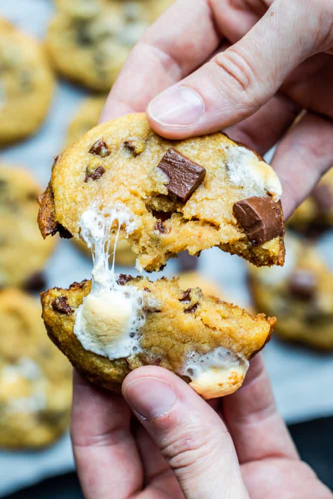 Image of hand pulling cookie apart.