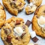 This Easy Chewy S'mores Cookies Recipe is the best twist on the classic summer campfire favorite! This recipe can be made ahead of time and is the perfect dessert for kids, families or to share with friends. Chocolate, marshmallows, and graham crackers just got better!