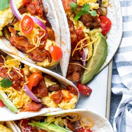 Overhead shot of breakfast tacos on a platter.