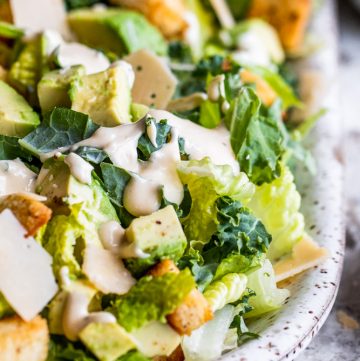 Kale salad on a white plate.