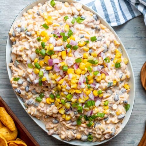 Overhead shot of white bowl of corn dip,