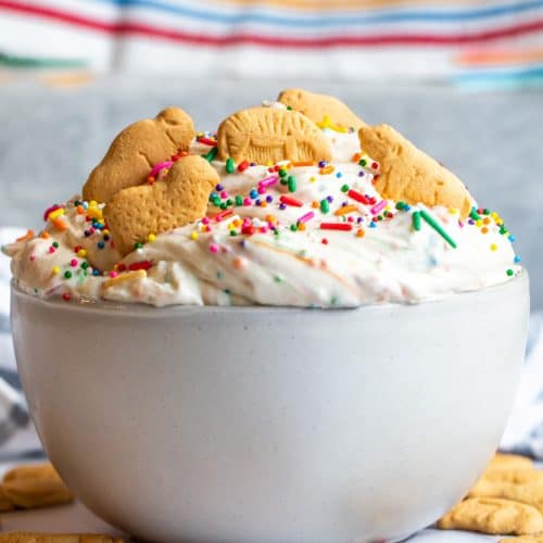 Strait on shot of dunkaroo dip in a white bowl on a white counter.