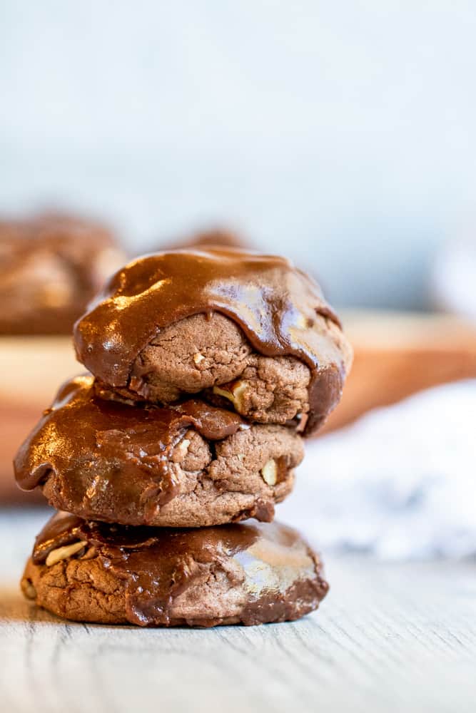 Stack of three cookies on a white counter.