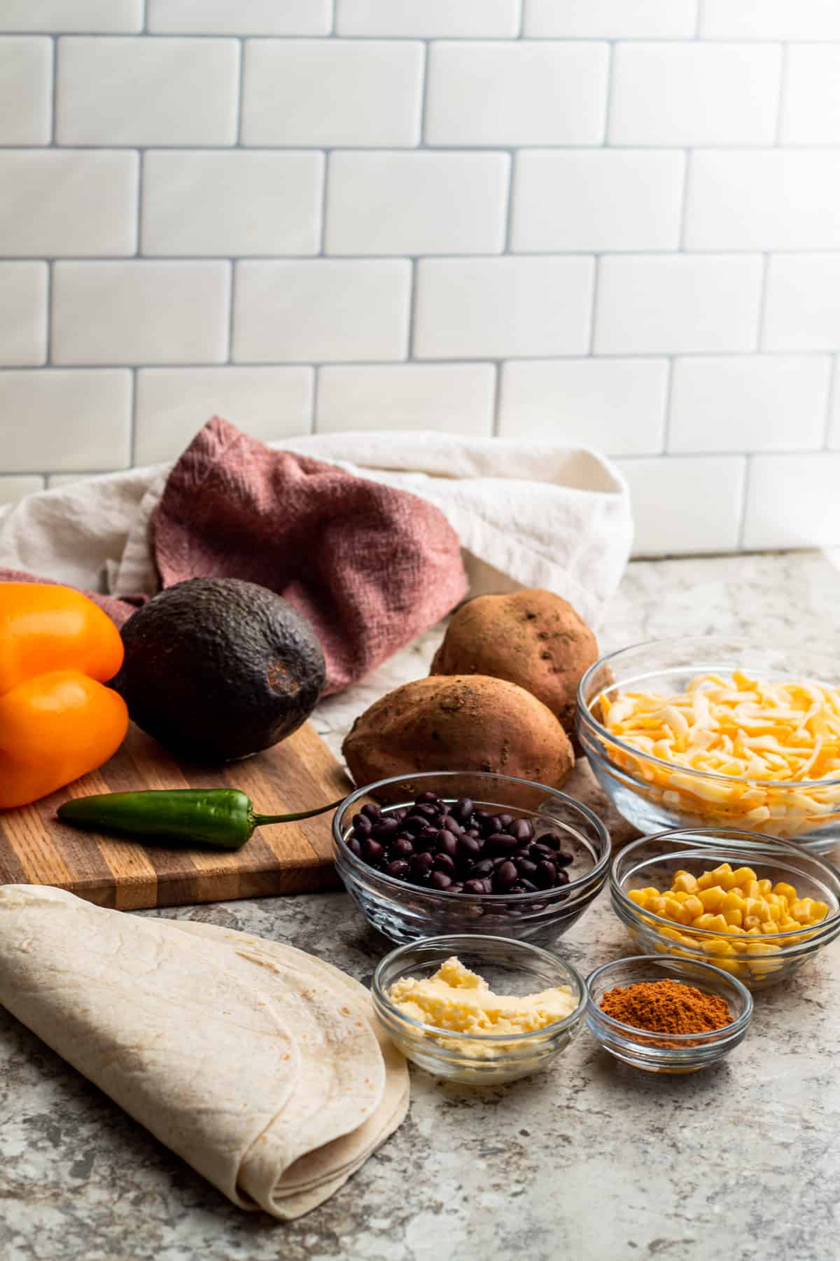 Vegetarian quesadillas ingredient shot showing all ingredients needed for this recipe on a white counter,