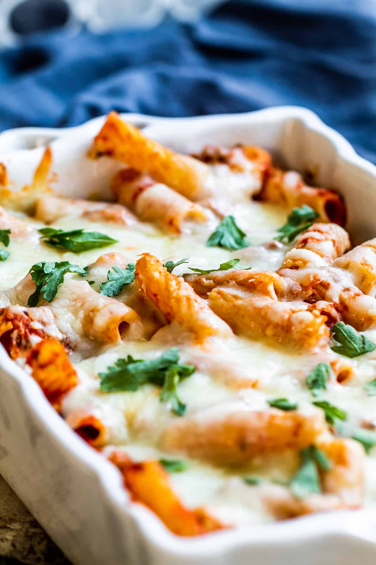 Mostaccioli in a white baking dish.