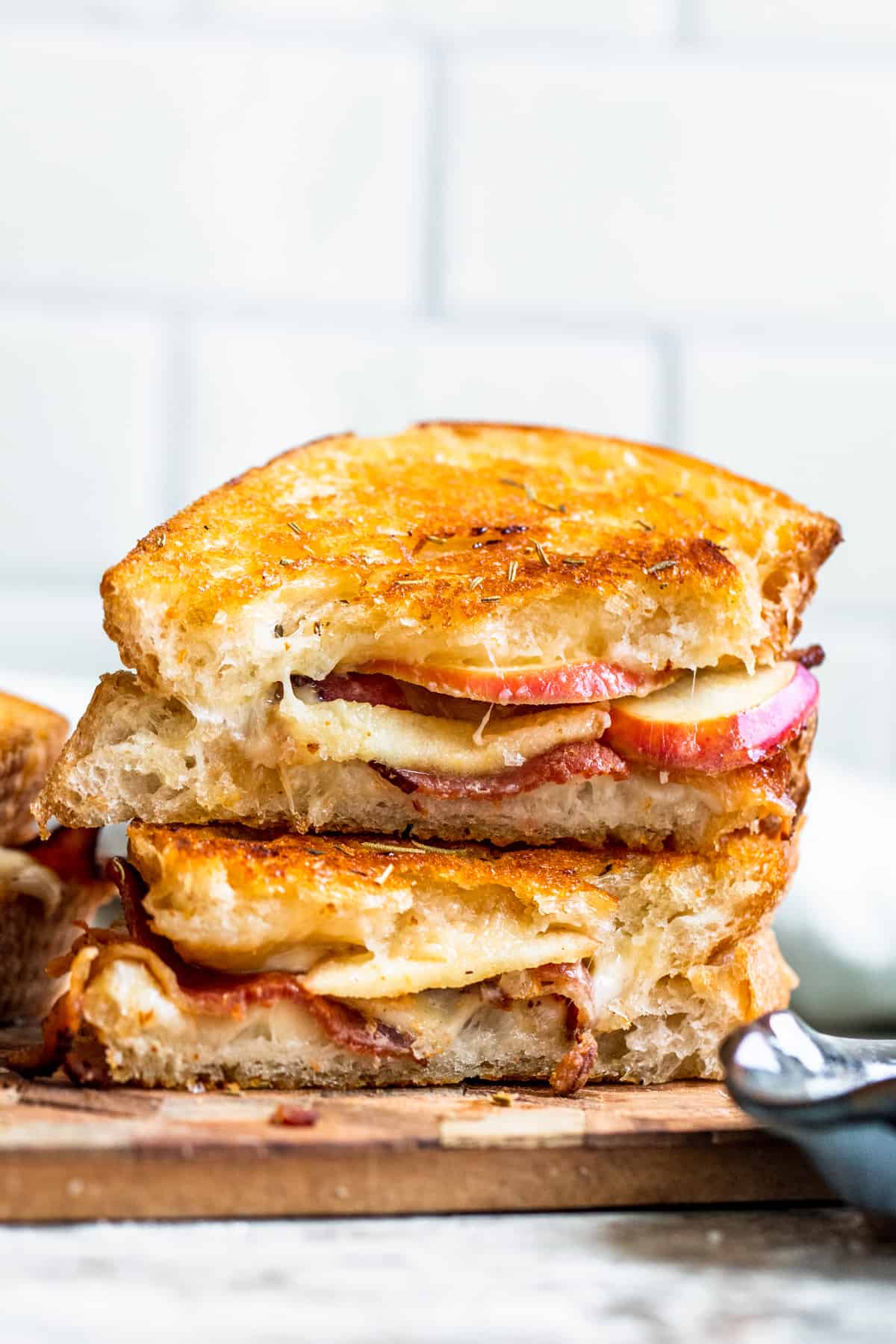 Strait on shot of apple grilled cheese stacked on top of each other.